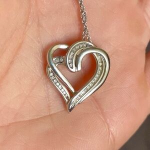 White gold heart shaped diamond necklace.